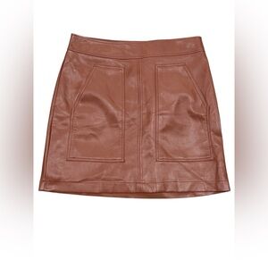 EUC. Loft skirt in brown faux leather. Size 8P. Pockets in front. Side zipper.